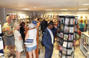 photo of patrons visiting the friends bookstore grand reopening in the atrium of the main library in 2023